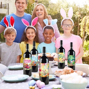 Close-up of Easter wine bottle stickers with rabbit and spring motifs at a family dinner