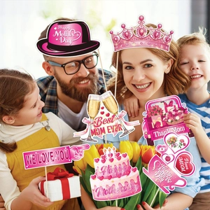 Pink Mother's Day photo booth props set featuring paper crowns and festive heart signs