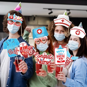 Nurse's Day party photo booth props set with festive slogan signs for nurses