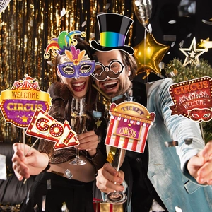 Carnival party photo props set with circus masks and signs displayed in a festive scene