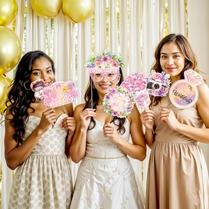 Funny wedding photo booth props including Bride To Be glasses and Happy Wedding signs
