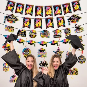 Close-up of rainbow gradient Congrats Grad banners and 2026 graduation party hanging swirls