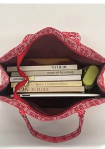 Interior view of red bridal tote bag showing large capacity for books and tablet