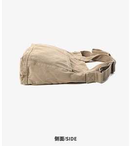Side view of khaki canvas crossbody bag showing durable texture and adjustable strap