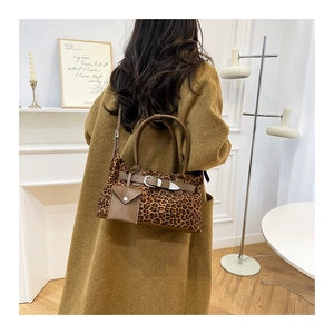 Chic leopard print tote bag with brown leather straps and matching small coin purse pouch