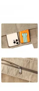 Detail of canvas bag featuring front storage pocket and smooth metallic zipper design