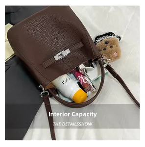 Detail view of brown leather bucket bag interior showing spacious capacity for daily essentials