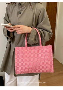 Detailed close-up of pink jacquard tote bag featuring traditional Chinese wedding motifs