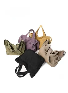 Detailed display of vintage canvas tote bags in army green, purple, yellow, black and khaki