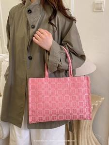 Pink Chinese wedding tote bag with double happiness pattern shown by female model