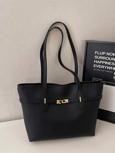 Chic black leather tote bag with gold geometric lock and textured lychee pattern finish