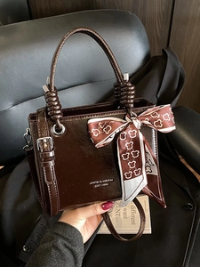 Vintage brown leather bucket bag for women with round handle and decorative scarf
