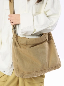 Japanese style khaki canvas messenger bag for women featuring large capacity and adjustable strap