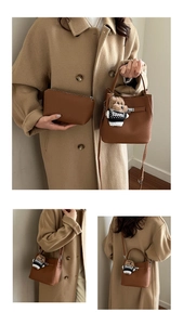 Brown litchi grain leather bucket bag set with cute plush bear charm and crossbody strap