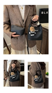 Detail of black lychee grain leather bucket bag set with mini pouch and cute bear charm