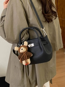 Minimalist black lychee leather bucket bag with silver lock and cute bear charm