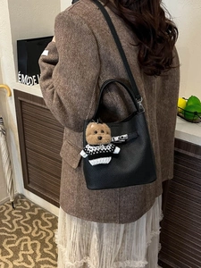 Vintage black leather bucket bag for women with silver lock and teddy bear charm