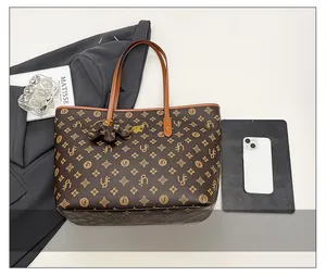 Top view of retro monogram tote bag with leather elephant charm and large capacity