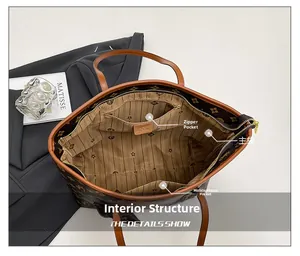 Macro view of the tote bag interior structure with zipper pocket and monogram lining