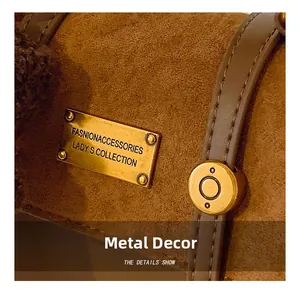 Close-up of golden hardware buckle and textured suede fabric on vintage brown backpack