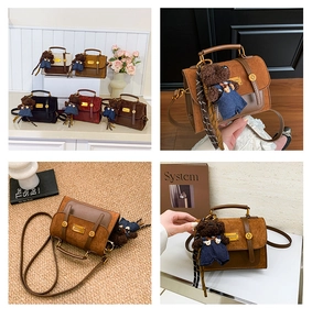 Detail of vintage crossbody bag with frosted leather texture and cute bear charm accessory