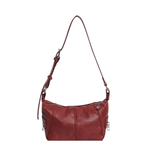 Deep red crescent underarm bag in textured leather with side zippers and star pendant