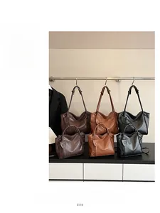 Three colors of soft leather tote bags in large and small sizes with adjustable straps