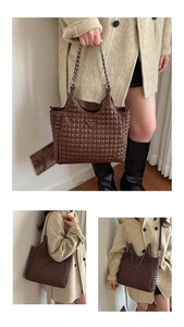 Detailed close-up of coffee brown quilted tote bag with chain strap and triangular plaque