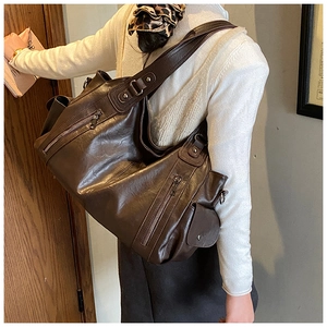Detailed view of deep brown large tote bag with multi-pocket design and retro oil leather texture