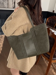 Vintage olive green leather tote bag with contrast stitching and woven detail for women