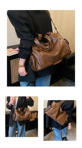 Detail of dark brown tote bag showing soft leather texture and multiple zipper pockets