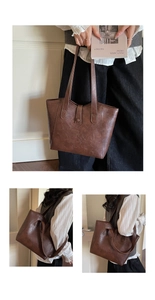 Detail of dark brown vintage faux leather tote bag showing spacious interior and texture