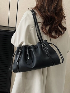 Fashionable black pleated tote bag in pebbled leather with drawstring closure for women