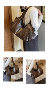 Close-up of the vintage brown faux leather shoulder bag with side zippers and pockets