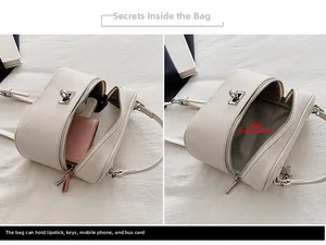 Internal view of cream leather box bag showing main compartment capacity for daily essentials