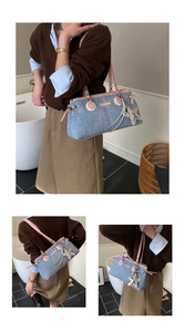 Detail der Jeans-Schultertasche mit rosa Lederriemen und großem silbernem Sternanhänger