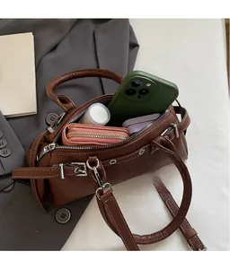 Brown lychee leather bag interior showing space for phone, wallet and cosmetics
