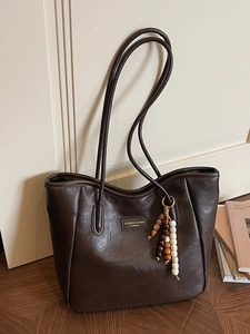 Dark brown faux leather tote bag with vintage wooden beads and shoulder straps