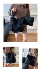 Dettaglio della borsa tote in pelle nera opaca con pochette abbinata e tracolla larga