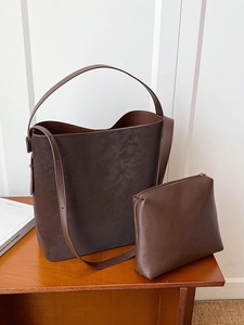 Brown matte tote bag and pouch set with large capacity bucket design and shoulder strap