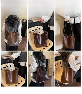 Detail shots of a vintage brown leather bucket bag showing strap and gold lettering