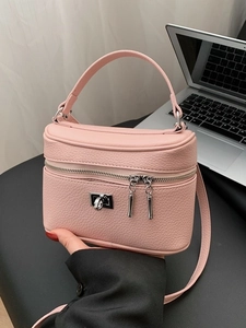 Pink pebbled leather box handbag for women, featuring a silver lock and top handle