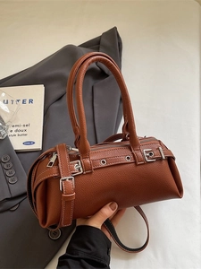 Brown lychee texture leather Boston bag with silver buckles and adjustable shoulder strap