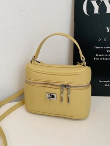 Yellow litchi textured PU leather box handbag with silver twist lock and adjustable strap