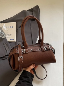 Brown litchi grain leather baguette bag with retro buckle details and adjustable strap