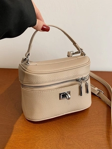 Beige litchi texture box tote bag with silver twist lock and crossbody strap for women