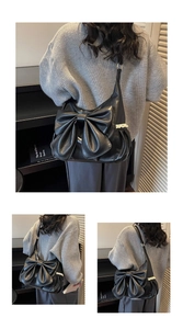 Close-up of black PU tote with large bow detail and white lace trim in retro style