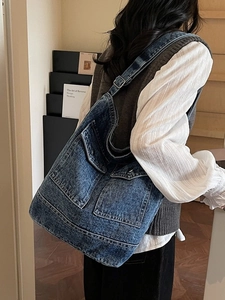 Large capacity dark blue washed denim tote bag with retro utility style cargo pockets