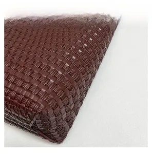 Close-up of deep wine red woven texture on a minimalist large capacity tote bag