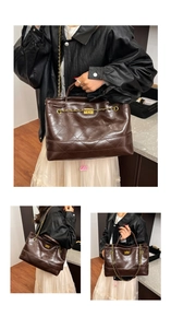 Close-up of dark brown quilted tote bag featuring glossy leather and gold chain strap